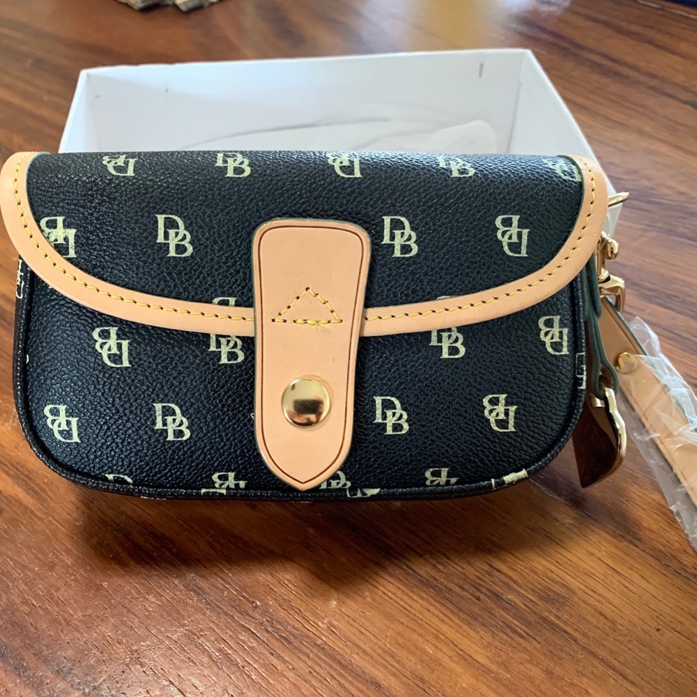 Authentic Dooney and Burke wristlet. New.